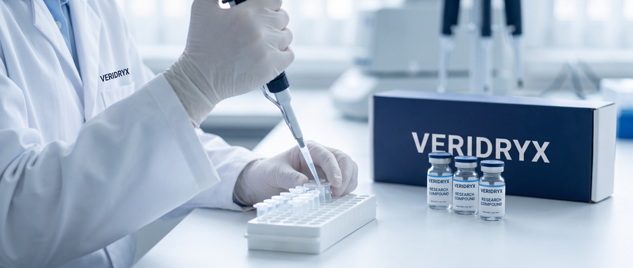 Lab technician pipetting samples with Veridryx research vials and box on the bench