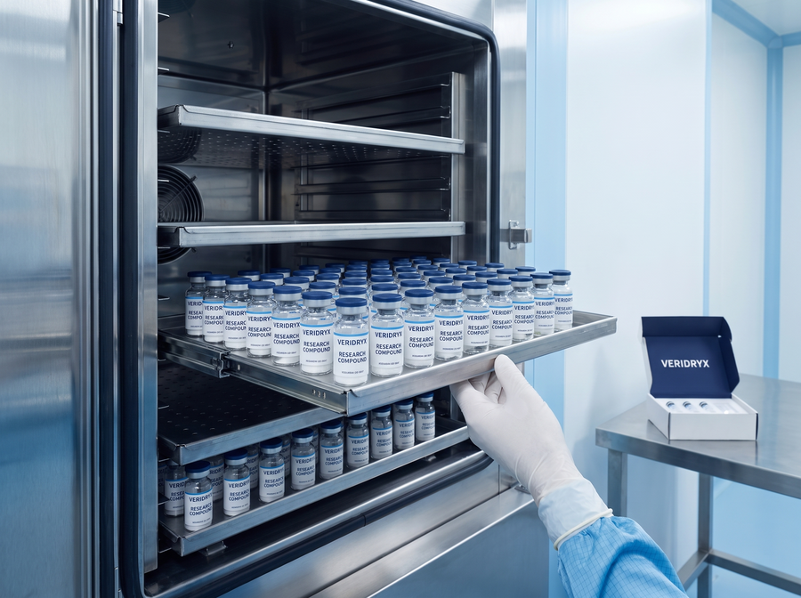 Freeze-dryer shelf loaded with Veridryx research vials after lyophilization